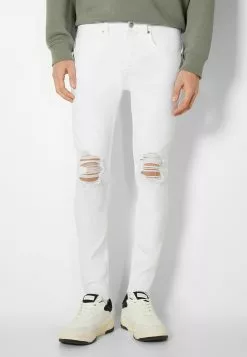 BERSHKA RIPPED - Slim Fit Jeans