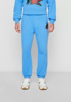 LACOSTE X NETFLIX - Trainingsbroek -Hemden Winkel d66750dffab6498d89c135999c945eee